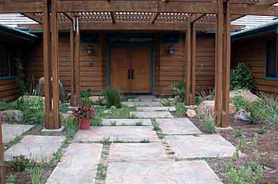 This entry passes over a stream and pond